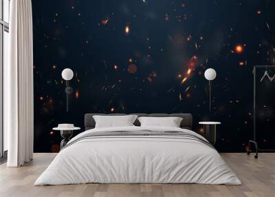 Sparks fly up Glowing particles on a black background and with flames Wall mural