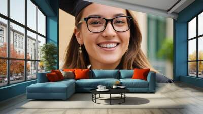 A young graduate, her European features radiant with accomplishment, stands before her alma mater. Her robe, a symbol of her academic journey, whispers tales of perseverance and triumph. Wall mural