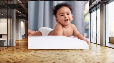 Home, happy and portrait of baby in bedroom for development, wellness and resting on weekend. Cute, innocent and face of adorable kid with diaper for comfortable, peace and growth in childhood Wall mural