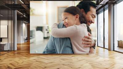 Family, father and daughter hug in the kitchen for love, trust or bonding together in their home. Kids, smile and safety with a happy young man embracing his adorable girl child in their house Wall mural