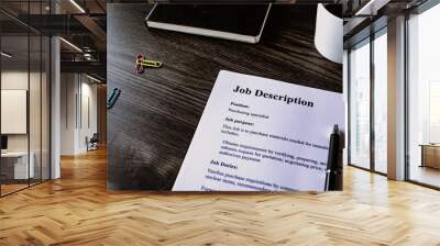 There is dummy documents that created for the photo shoot on the desk about Job Description. Wall mural