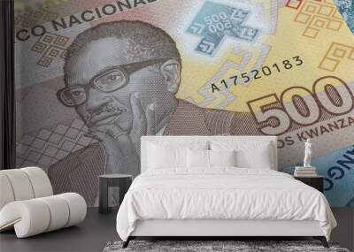 Close up to 500 Kwanza of the Republic of Angola. Polymer banknotes of the African country. Detailed capture of the portrait of the first president Agostinoh Neto. Currency bank note Kwanzas Wall mural