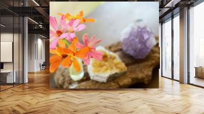 Amethyst and Citrine clusters on a wooden table, small vase of fresh flowers. Shot on macro lens in natural lighting. Bright colors, healing crystal clusters. Hippie natural healing and fresh herbs.  Wall mural