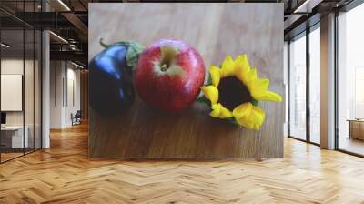 Fresh picked Apples, Eggplant, and Sunflower shot in Puerto Rico. Organic farming, fresh farmers market fall harvest. Delicious organic food.  Wall mural