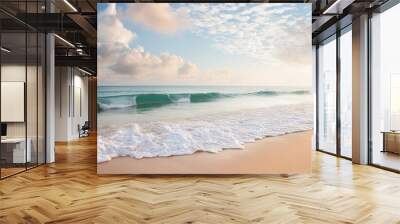 sandy beach pastel background blue cloudy sky and soft ocean wave in warm sunset light Wall mural