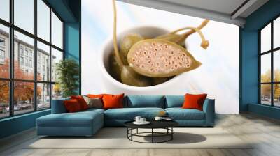 Sliced ​​capers on the white background. Wall mural