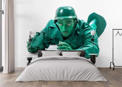 Man on a green toy soldier costume Wall mural