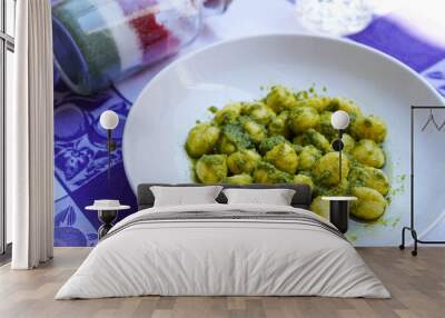 Closeup of homemade Italian gnocchi with pesto sauce	 Wall mural