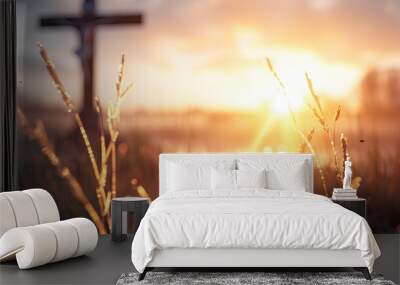 Golden sunset over field with christian cross silhouette on orange sky background religion faith Jesus Christ God hope love easter concept Wall mural