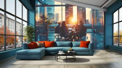 Team in modern office discussing business strategy at sunset, overlooking cityscape through large windows. Wall mural