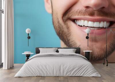 Wide shot with copy space on man's perfect teeth smile on blue with copy space . Wall mural