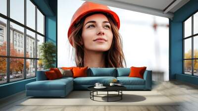 Female engineer in protective helmet and safety vest working at construction site Wall mural