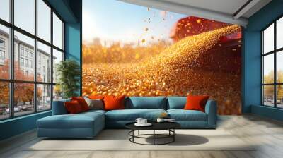 Corn kernels pouring from a red combine harvester, golden stream of corn against blue sky, sun flare, motion blur, shallow depth of field, agricultural harvest scene. Wall mural