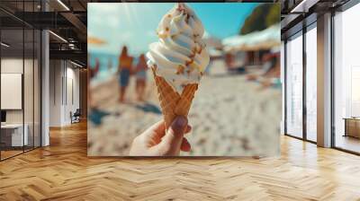 Ice cream in hand on the beach with people walking around blurred, summer vibe, close up, focus on ice cream in the style of blurred people walking around, summer feeling.
 Wall mural