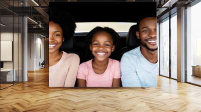 A joyful family smiling together in a car, capturing happy moments and love on a road trip or family outing. Wall mural