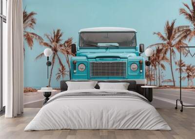 Classic blue vintage truck surrounded by palm trees on a sunny coastal road Wall mural