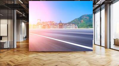 Blue sky mountain european-style castle building and asphalt highway Wall mural