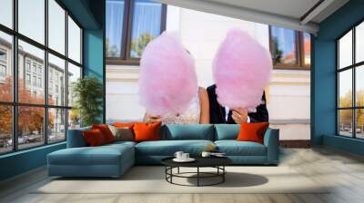 Beautiful wedding couple have a special time together, they posing with pink Cotton Candy Wall mural