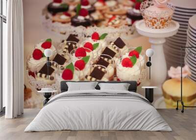 Delicious candy bar with macarons, cupcakes, cake pop and other sweets Wall mural