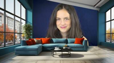 Portrait of beautiful teenage girl smiling Wall mural