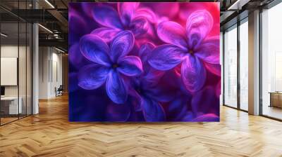 Delicate purple flowers are beautifully blooming, illuminated by soft, colorful light, creating a dreamy atmosphere with a blurred, abstract backdrop Wall mural