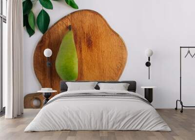 pears in a plate and slices of pears top view. wooden background with pears Wall mural