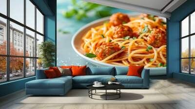 Spaghetti topped with flavorful meatballs and garnished with fresh herbs sits invitingly on a white plate Wall mural