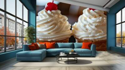 Two ice cream cones topped with vanilla cream and cherries Wall mural