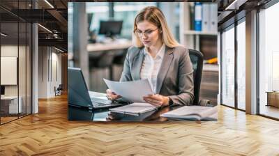 Professional Accountant Woman In Office Doing Accounting, around files and checking ledger Wall mural