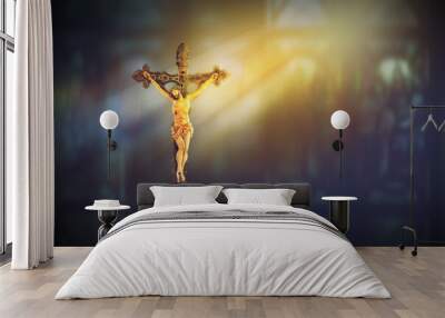 crucifix, jesus on the cross in church with ray of light from stained glass Wall mural