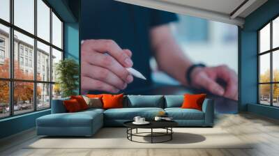 hand using stylus pen signing on digital tablet during online working, Paperless workplace idea, e-signing, electronic signature, document management, e-signing, digital document management Wall mural