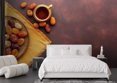 Eid al-Fitr holiday concept with sweet dried dates, fruits and decorations on background. Top view from above. dark brown background. Wall mural