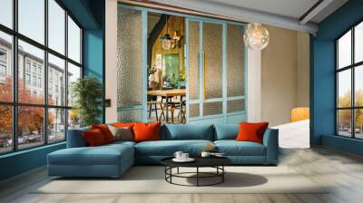 interior of a loft style room with vintage furniture and steel pastel blue windows Wall mural