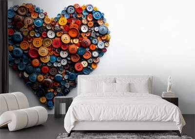 A close-up of colorful tiny plastic buttons arranged in a heart shape on a white background Wall mural