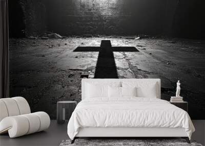 A dramatic cross shadow cast on a cement wall, creating a strong contrast between light and dark Wall mural