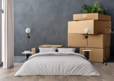 Delivery van surrounded by cardboard boxes on muted gray backdrop Wall mural