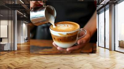 Expert barista crafting a rich cappuccino with perfectly frothed milk and beautiful latte art Wall mural