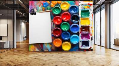 vibrant array of colorful paints next to a blank sketchpad inviting creativity and artistic expression Wall mural