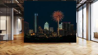 A stunning Fourth of July fireworks display lighting up the night sky over a vibrant city skyline, celebrating independence and freedom with colorful bursts of light and an electric atmosphere. Wall mural