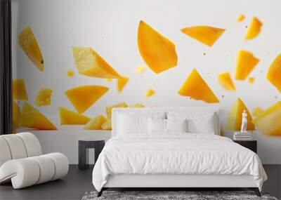 Fresh and vibrant mango pieces tossed in the air against a clean white backdrop, capturing the essence of summer.  Wall mural