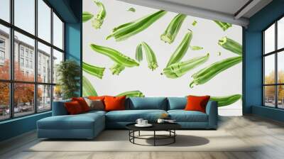 Scattered okra pods floating in mid-air against a pristine white background, showcasing vibrant green colors and intricate details Wall mural