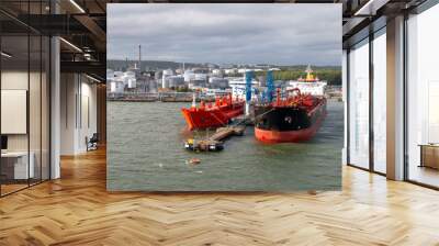 Tank farm in Gothenburg Sweden, cargo ships are in dock to load or unload their freight Wall mural