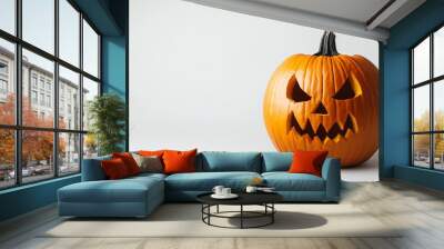 Halloween JackoLantern pumpkin with a spooky face isolated on a white background Wall mural