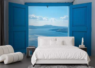 View from an open window with blue shutters of the Aegean Sea caldera coastline and the whitewashed town of Oia Santorini Greece Wall mural