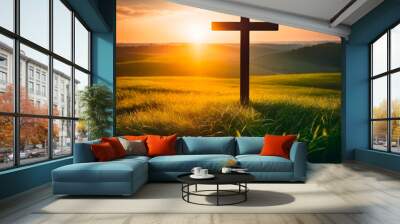 Cross at sunset in the countryside. Christian cross on the meadow. Wall mural