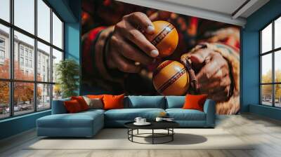 Close-up of hands holding and shaking two wooden maracas Wall mural