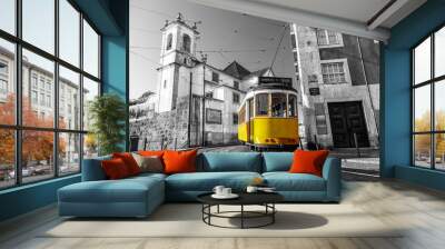 Black and white picture of a yellow tram on the streets of Lisbon, Alfama, Portugal near Santa Luzia church Wall mural