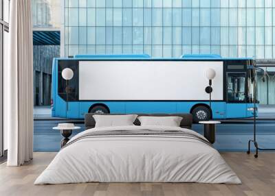 Side view of a blue city bus with a large blank white mockup area. Wall mural