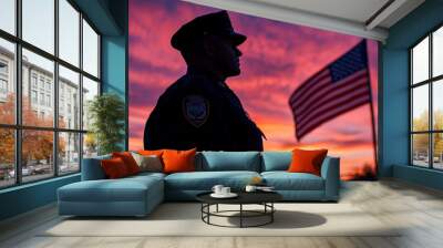 Silhouette of police man with USA flag against the sunset. Wall mural