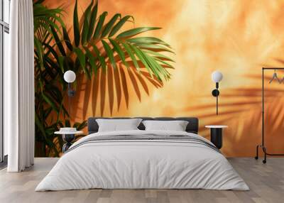 Warm orange and beige summer color background with tropical palm shadow. Wall mural